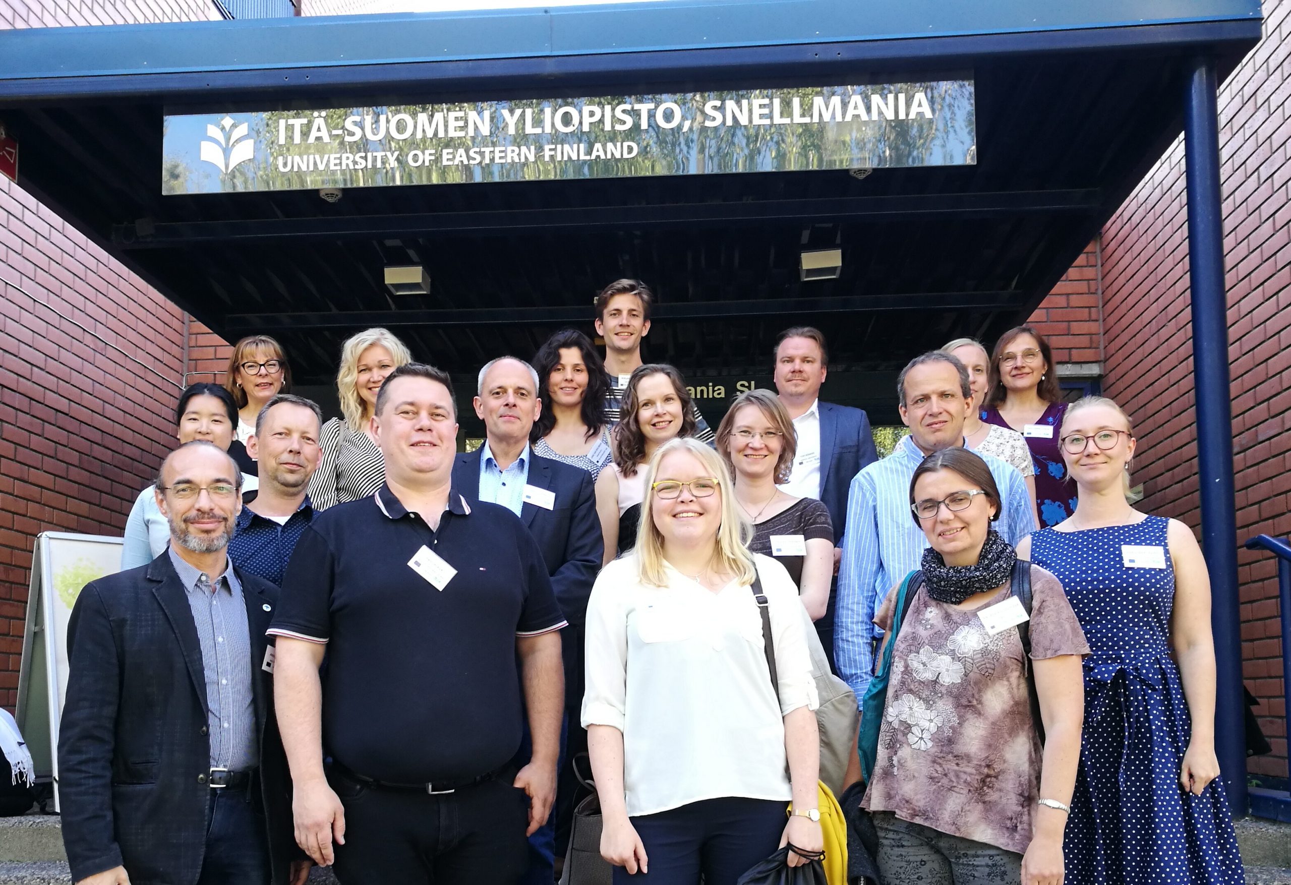 Group picture of consortium members at the entrance of the University of Eastern Finland